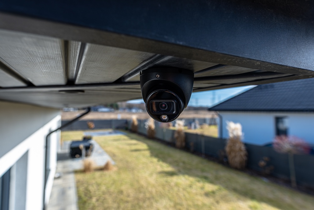 Security camera placed outside home, underneath roof